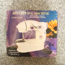 MINI ELECTRIC PORTABLE SEWING MACHINE JYSM-202A WITH  ACCESSORIES PLUS MANUAL