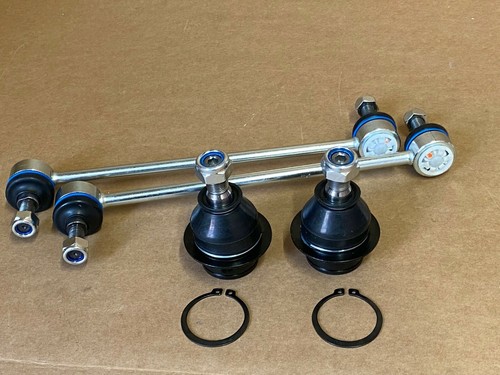 Pair front lower ball - of,