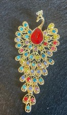 stunning peacock brooch