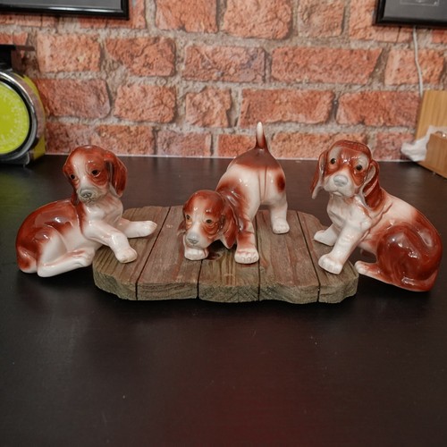 Three bone china dog figurines