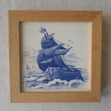 Framed Delft tile of a ship