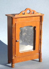 Vintage dolls house wardrobe.