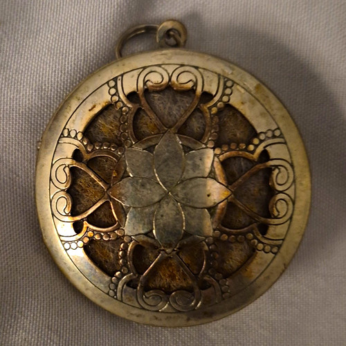Silver tone round locket - tone,