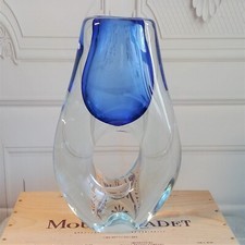 Glass vase with hole in middle