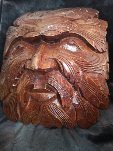 Hand carved green - man, wall