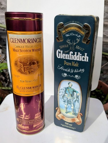 Decorative whisky tins and a - and,