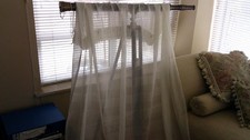PAIR OF CREAM VOILE CURTAINS - THREE INCH HEADER TAPE