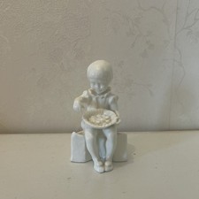 Royal Worcester seated boy Porcelain Figure