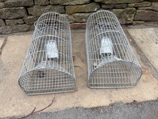A pair of humane rat trap cages