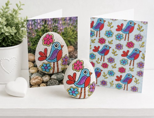 Hand painted bird pebble with - hand,