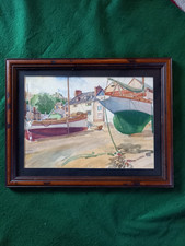 Framed watercolour of boats in