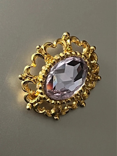 Vintage gold tone brooch with