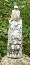 Totem pole stone garden ornament weathered