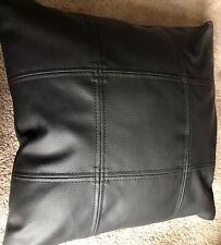 Leatherette Cushion. Square pattern on front. Zipped.