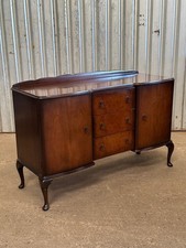 A 1950’s walnut and burr walnut sideboard