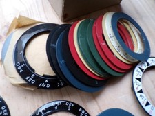 34 VINTAGE TELEPHONE PLASTIC DIAL LABEL RINGS + 1 ENAMEL DIAL+ 13 METAL MOUNTS