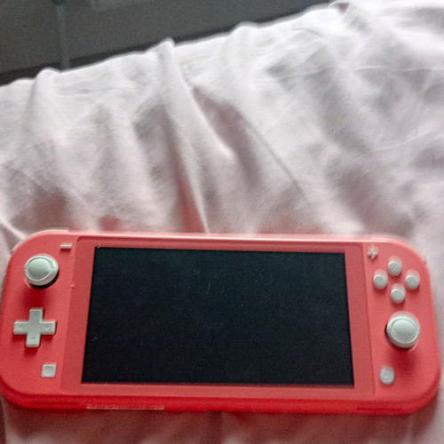 Nintendo switch lite coral - nintendo,
