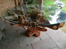 Teak root dining table with glass top and with festive lights 