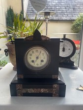 Extremely clean antique slate and marble chiming mantle clock in working order.