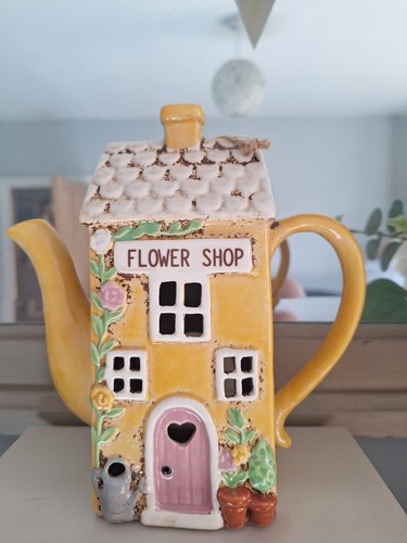 Village pottery teapot flower - teapot,