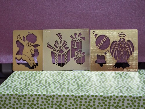Three brass stencils - three, stencils.