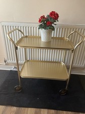 VINTAGE CAREFREE 2 TIER GOLD COLOURED METAL HOSTESS SERVING TEA TROLLEY GIN CART