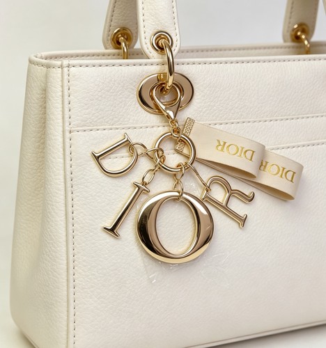 Dior gold tone letter - gold,