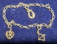 A sterling silver charm bracelet made in England