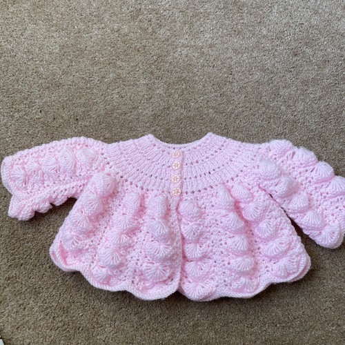 Hand knitted pink baby - hand,