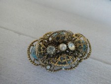 A SPHINX GOLD TONE BEAD BROOCH