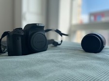 Canon EOS 700D 18MP DSLR Camera with Lens - Black. With flip screen and tripod