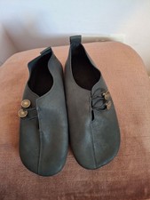 Black soft leather shoes, worn
