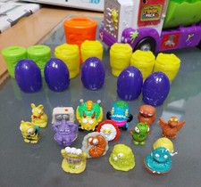 15 trash packs  Figures with sewer vehicle and drawstring  trash bag included 