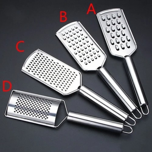 Hand held cheese grater with - held,