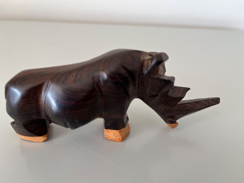 Hand carved wooden rhino - hand,