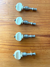 Vintage banjo tuners: grip tuning pegs. Ivorine with nickel plated spindles Used