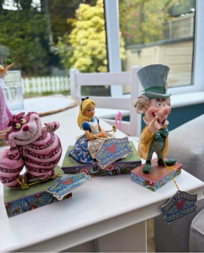 Disney traditions alice - traditions,