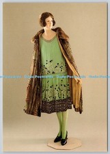 D322648 Beaded chiffon evening dress and lame cape. Late 1920s. The Museum of Co