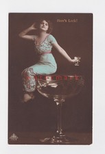 GERMANY SURREAL SURREALISM BEAUTIFUL WOMAN SITS ON EDGE OF GIANT WINE GLASS NV79