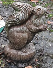 garden statues pre owned squirrel red cement colour.