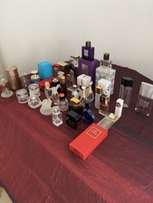 A Collection Of Empty Designer Perfume Bottles