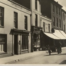 Old Ely street, Lamb hotel, motorbike sidecar gas lamp burrows newsagents c.1900