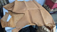 box of old leather offcuts for craft use assorted colours