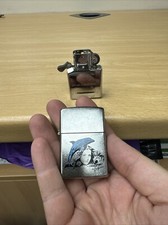 Genuine Zippo. The dolphin by Mazzi. NEW Without Box