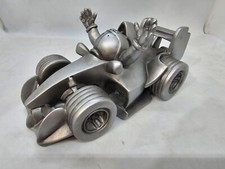 Jim Bamber collectible figure features The Stig, the iconic racer Formula 1