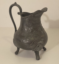 Antique pewter cream jug