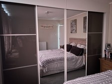 2 Mirror & 2 gloss sliding Wardrobe Doors including  wardrobe shelves & rails.  