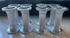 8  silver coloured cake pillars, cylindrical, 9cm high, diameter 4.6cm
