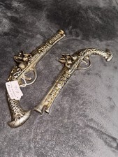 Brass/chrome Guns Pair