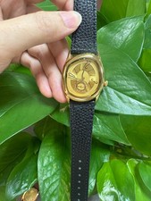 Quartz watch in Gold with similar design to Berneron Mirage, cartier crash